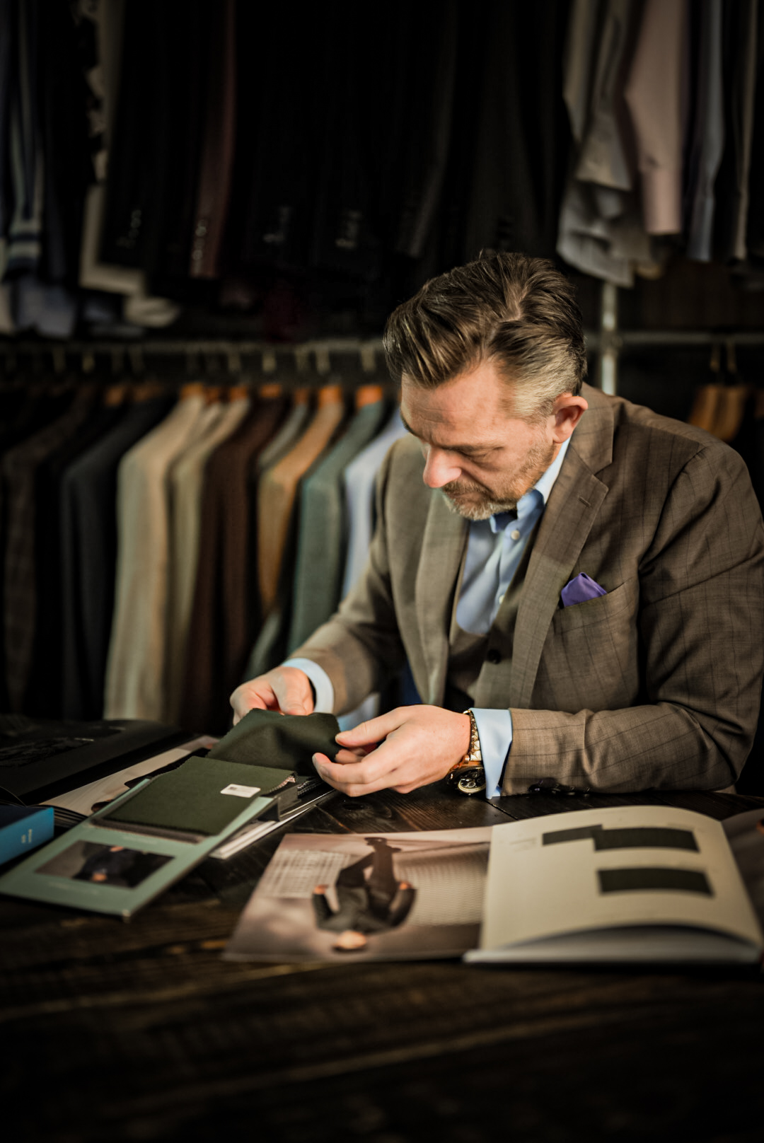 Søren examining a fabric sample